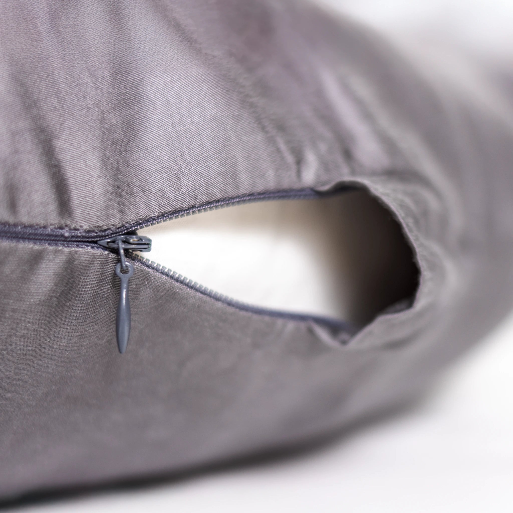 "Close-up of Comfybud body and pregnancy pillow with zippered removable cover, showcasing premium design for easy cleaning and cooling comfort